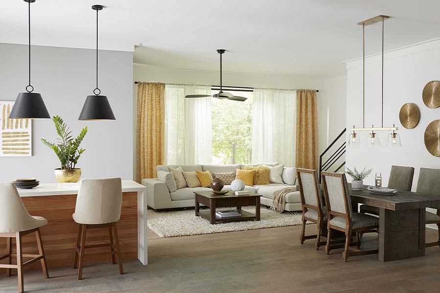 modern interior home setting with modern style pendants, ceiling fans and chandelier