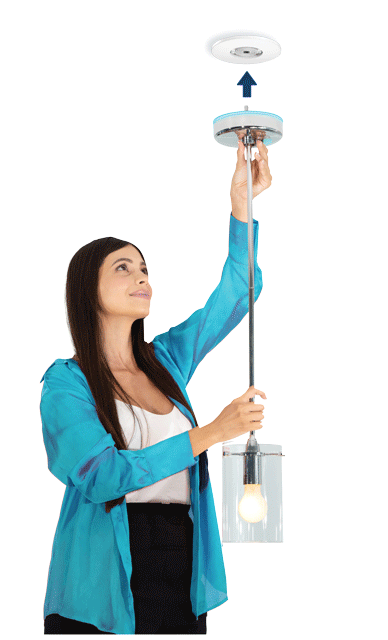 woman in a blue blazer easily plugging in a lighting fisture with a smart plug canopy from skyx platforms